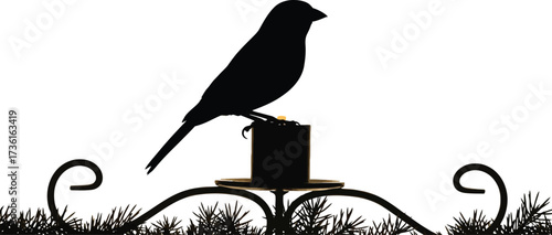 Silhouette of a bird perched on a candle holder design