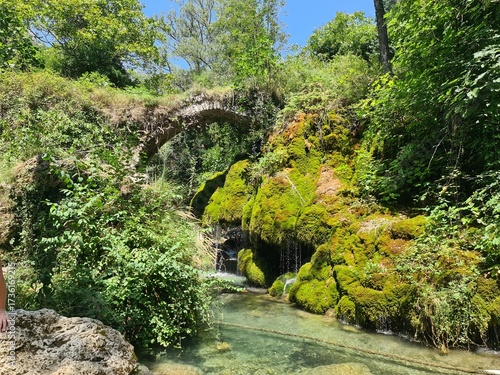 Waterfall Capelli di Venere, small mountainside cascade surrounded by vegetation, close to a ruined mill, Casaletto Spartano, Province of Salerno, Italy