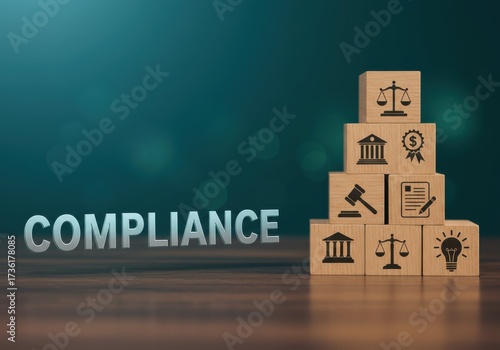 Compliance icons stacked on wooden blocks on a wooden table against a green background from a straight-on viewpoint