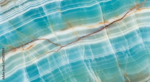 Close up of aqua blue and white banded onyx with brown vein detail