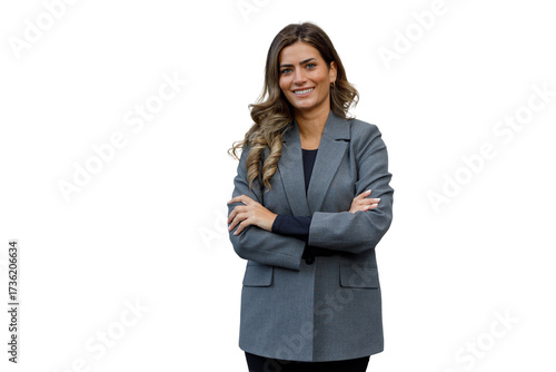 Professional businesswoman smiling confidently, posing with crossed arms, wearing a grey blazer, transparent background
