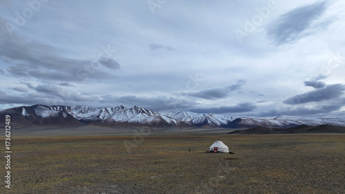 Snowy mountains and a nomad tent in the rural area of ​​Tolbo, Mongolia.