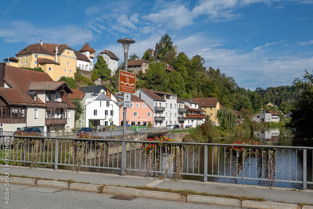 Obraz premium Hals, Bavaria, Germany: bridge over the Ilz river, with name sign, on a sunny day in summer, just upstream of the confluence with the Danube and Inn rivers in Passau