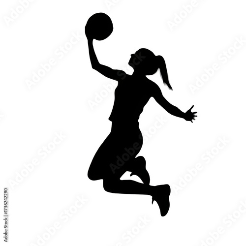 silhouette of a woman jumping with ball
