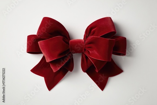 Elegant red bow made of soft velvet, perfect for festive decorat