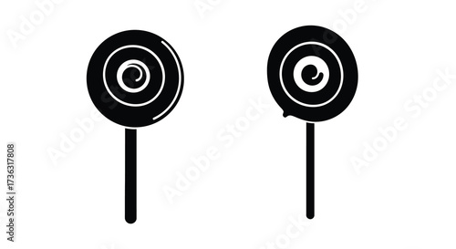 Two black and white spiral lollipops isolated on a white background