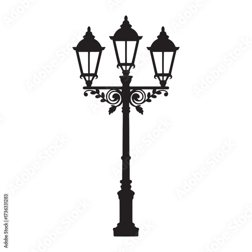 Elegant Silhouette of a Three-Lamped Victorian Streetlight Casting a Timeless Glow in the Darkness Revealing an Intricate Design