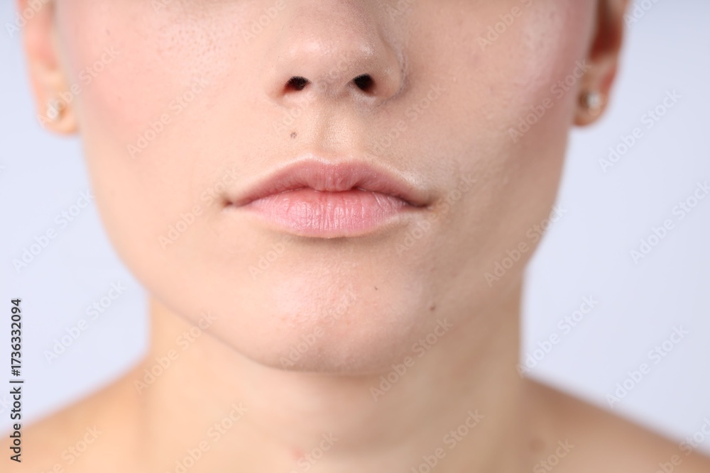 Obraz premium Woman with normal skin on light background, closeup