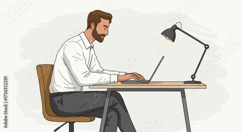 Focused Professional Working on Laptop at Desk