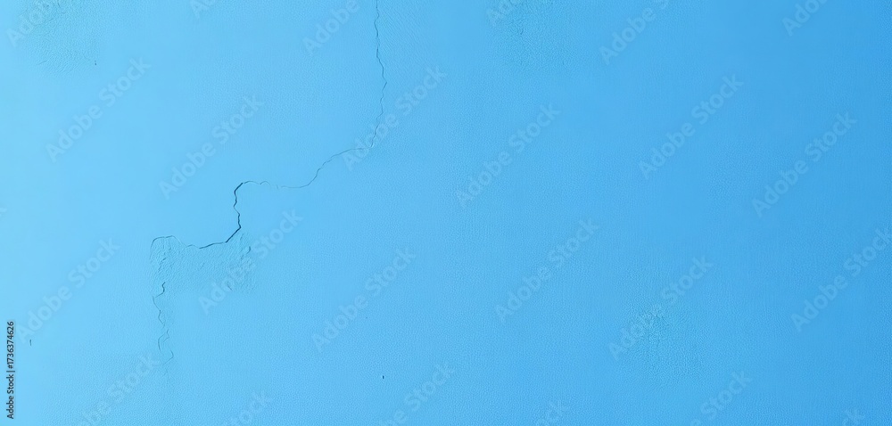 Fototapeta premium Smooth, textured blue concrete wall, varying shades, aged, teal