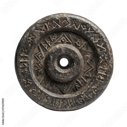 Circular, dark gray stone disc, intricately carved with repeating, stylized patterns.  A central hole is present