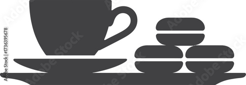 Silhouette of a coffee cup and saucer with macarons on a tray