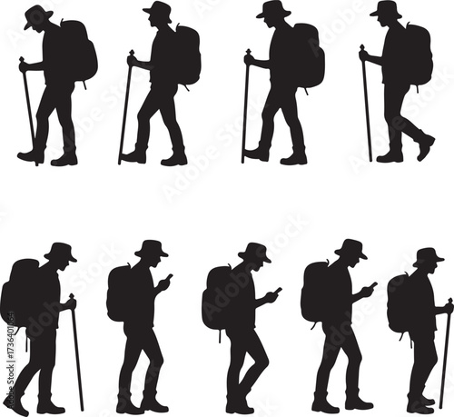 Silhouette hikers with backpacks and walking sticks
