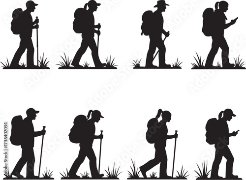 Silhouette hikers with backpacks and trekking poles