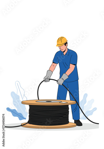 An electrician working with a large spool of cable.