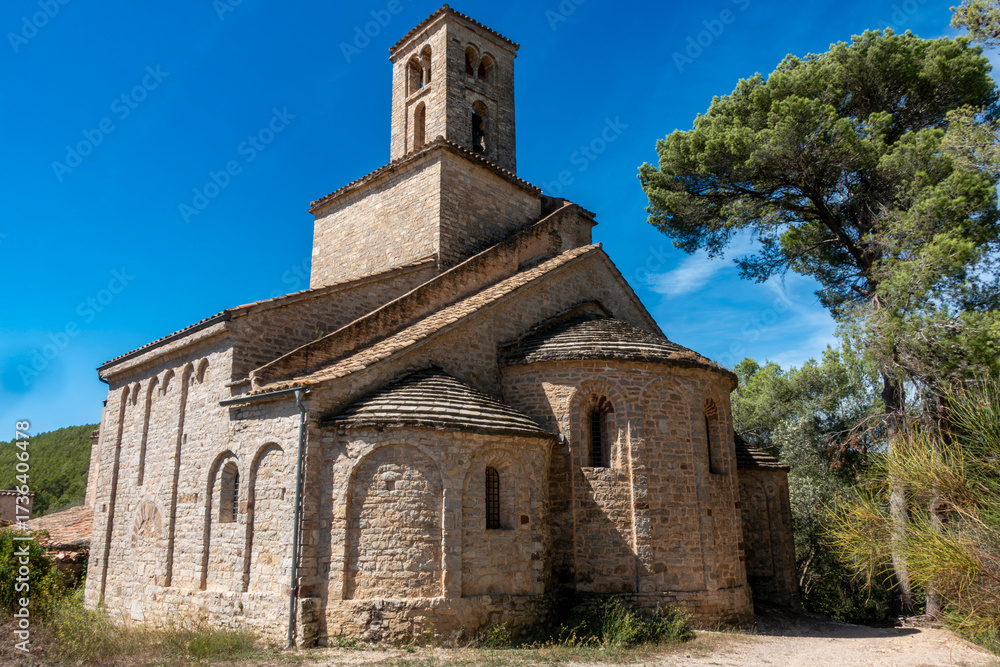 Fototapeta premium Ancient Catalan Romanesque Architecture Sant Ponç de Corbera Church Barcelona Spain 11th Century Medieval Apse and Stone Bell Tower