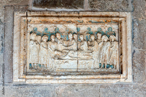 The alabaster tomb slab of Abbot Berenguer Arnau (d. 1206), a masterpiece of early 13th-century Catalan Gothic sculpture. Sant Juan de les Abadesses, Catalonia