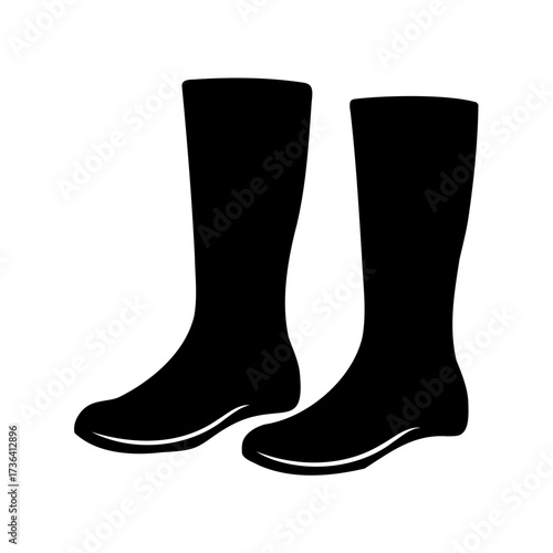 Two black wellington boots standing isolated on a plain white background