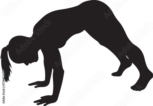 Black silhouette of a woman in a downward dog yoga pose