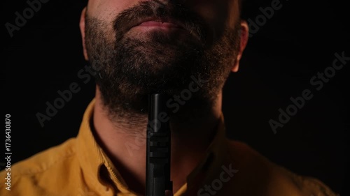 Man Holding a Handgun to His Throat — Staged Conceptual Shot (Sensitive Content)