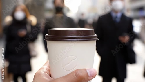 Steaming Coffee in Crowded City: Masked Commuters, Urban Life, Warmth