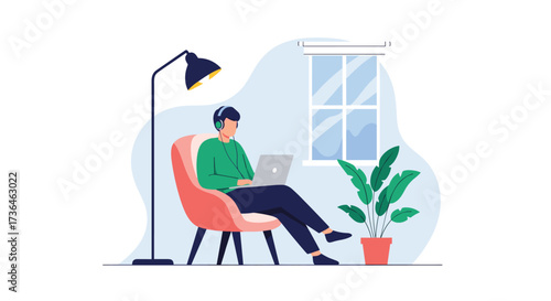 Man working on laptop while listening to music at home.