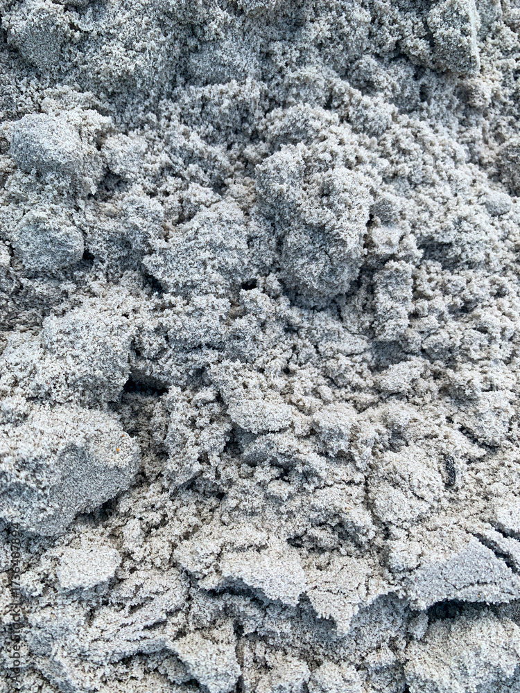 Fototapeta premium Texture of wet gray sand, background, texture