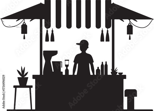 Silhouette of person at food stall with awning and hanging lanterns