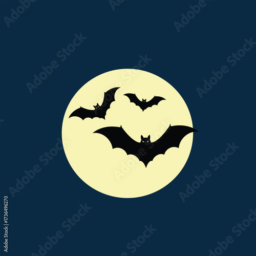 Spooky Halloween night scene with black flying bats silhouetted against a bright full moon