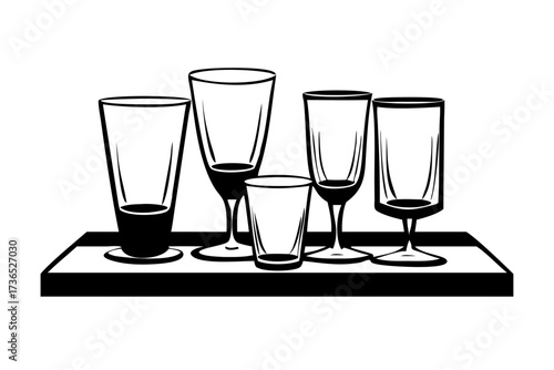 Collection of transparent water and juice glasses with clear liquid drink