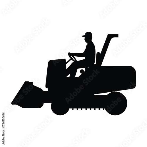 Silhouette of a construction worker operating a compact loader with a bucket attachment
