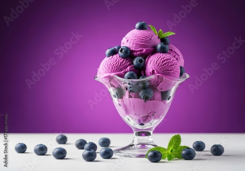 Delicious blueberry ice cream sundae with fresh berries isolated on white background