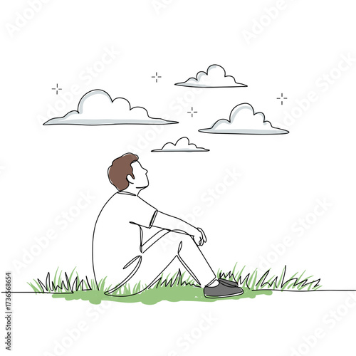 Young man sitting on grass and looking at clouds in daytime  