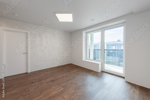 Empty Living Room or Bedroom Interior. White Walls Room Corner and Window. Interior with Empty Room White Walls and Wooden Floor.