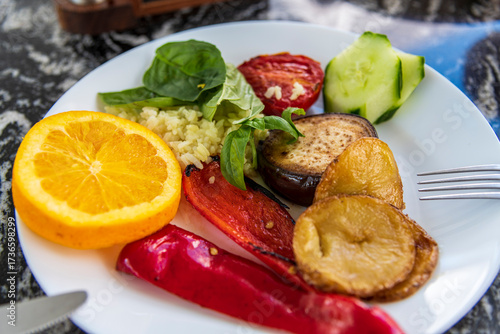 Delicious roasted vegetables served on a plate, showcasing vibrant colors and appetizing texture. A healthy homemade meal full of flavor and freshness, perfect for concepts of vegetarian food, healthy