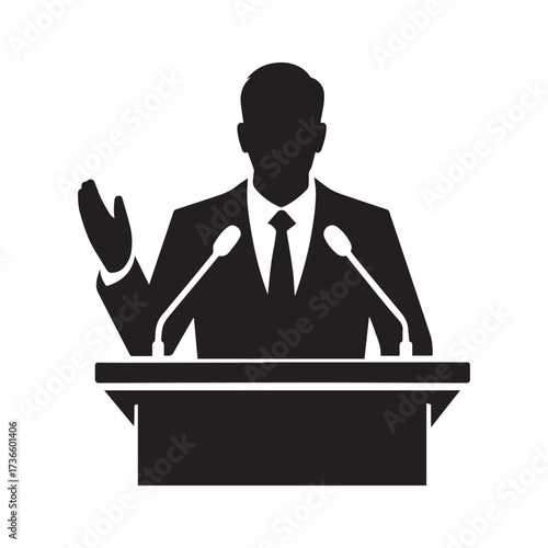 Man speaking at podium with microphones silhouette