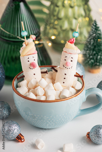 Marshmallow Snowmen in Mug with Christmas Ornaments and Trees
