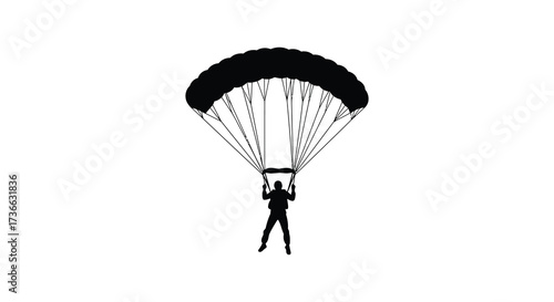 Silhouette of a skydiver descending with open parachute high above