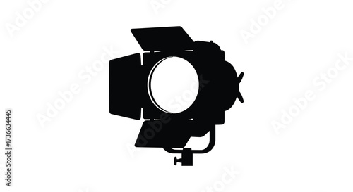 Silhouette of a professional film studio light with adjustable barn doors for creative projects