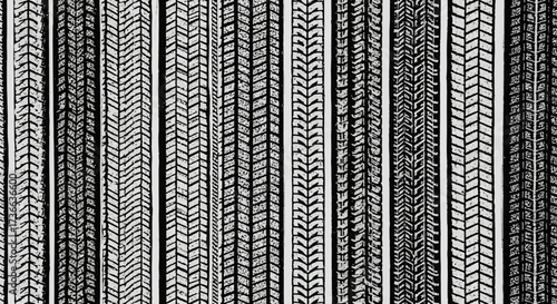 An Abstract Arrangement of Parallel Vertical Ribbons Featuring Intricate Repeating Decorative Patterns in Black and White