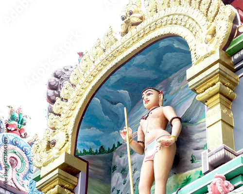 deidad hindú con bastón