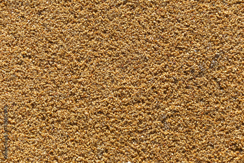 Brown epdm flooring, where the material is shaped like sand but is soft.