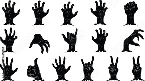 Spooky zombie hands reaching up from the ground in various gestures and poses