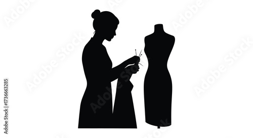 Silhouette of a fashion designer tailoring a dress on a mannequin studio portrait