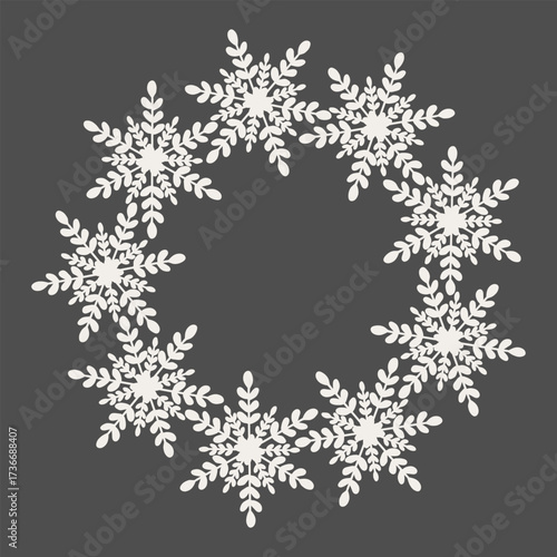 Elegant white snowflake wreath with intricate floral branches, seamless circular pattern on dark background for holiday decorations and designs