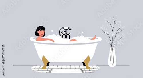 Woman Relaxing in a Bubble Bath in a Clawfoot Tub bathtub bubbles