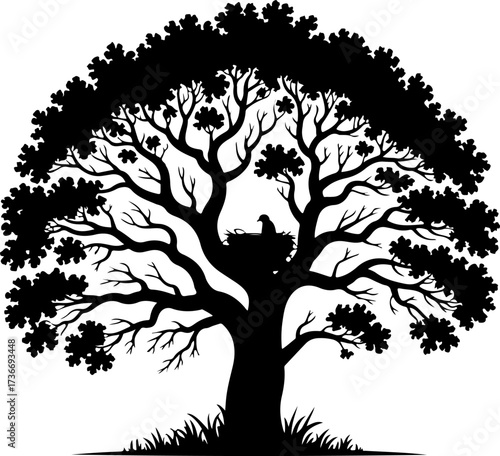 Majestic Silhouetted Tree with Nest and Bird - A Symbol of Nature and Life