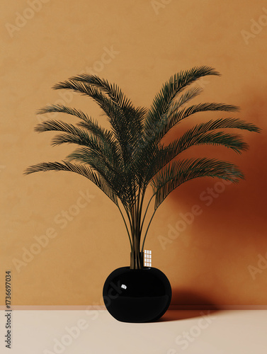 Minimalist decor with a dark feathery plant in a glossy black vase