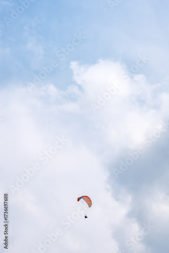 Wallpaper Mural Paraglider soaring beneath a cloudy blue sky in Turkey Torontodigital.ca