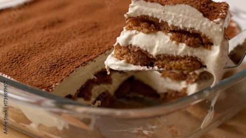Classic Tiramisu Dessert with Layered Cream and Coffee Soaked Ladyfingers Sprinkled with Cocoa Powder